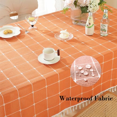 Rakila Rustic Checkered Cotton Linen Tablecloth - Orange 55x102 Inches, Waterproof, Tassel Decor for Kitchen & Dining, 10-12 Seats