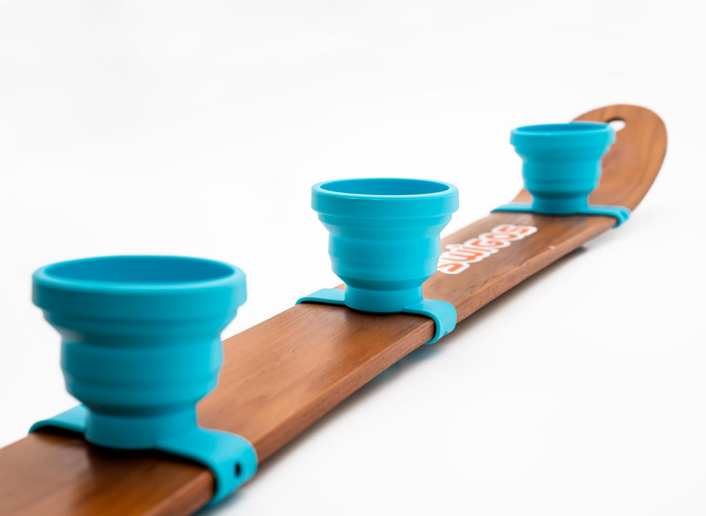 SWIGOS - Collapsible and Portable Shot Ski Kit - 4-pack w/ carrying pack. Silicone cups with an adjustable strap that turn any object into a "shot ski"