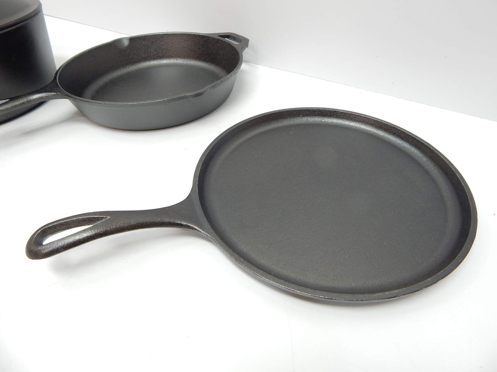 Lodge Cast Iron Set - 4-Piece Set - Pre-Seasoned Kitchen Set - Skillet, Griddle & Dutch Oven Included - PFAS-Free Non-Toxic Cookware