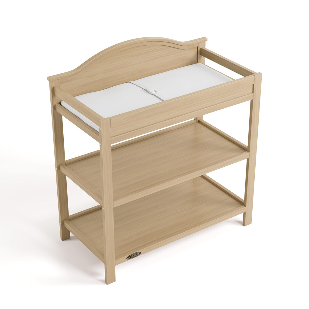 Graco Story Changing Table with Water-Resistant Pad – GREENGUARD Gold Certified Baby Changing Station with Safety Strap, 2 Open Shelves, and a Nursery Must-Have Design (Espresso)