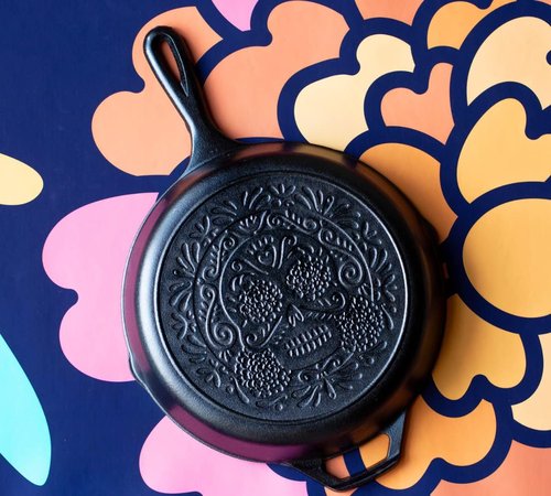 Lodge 10.25 Inch Pre-Seasoned Cast Iron Skillet - Versatile Sugar Skull Design - Ideal for Oven, Stove, Grill, or Campfire