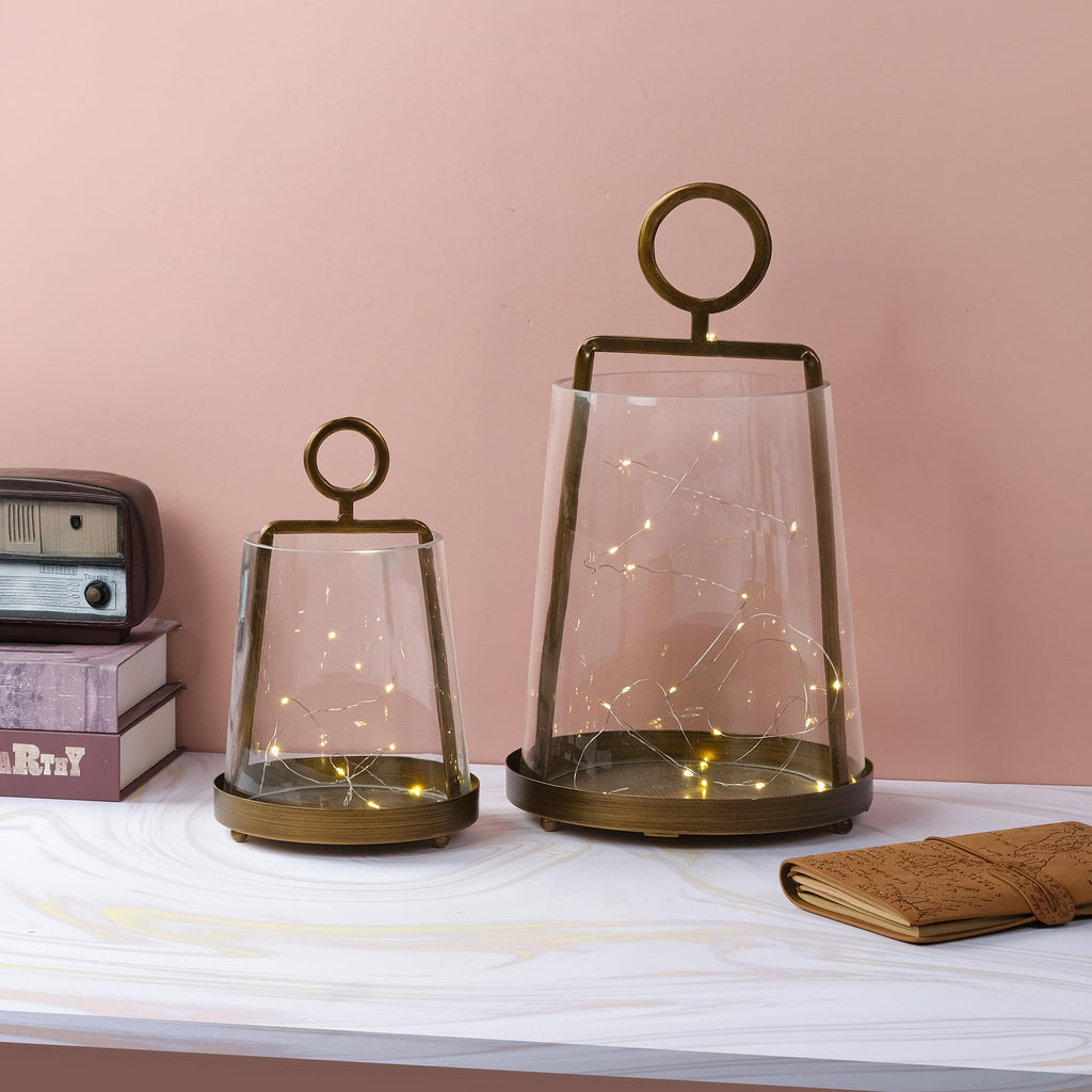 Twakutwaku 6" Wide Modern Farmhouse Metal Hurricane Candle Holder with Handmade Sturdy Glass Sleeve in Antique Brass for Pillar Candle & Plants, Glass Hurricane Lantern, Industrial, Minimalistic