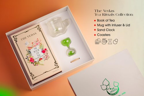 The Vedas Tea chest Premium Tea gift set | 48 handstitched cotton teabags | 12 flavours | 1 The Vedas Branded Mug with Infuser | 1 Sand clock specially designed for our teas | 1 Coaster