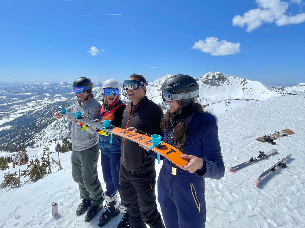 SWIGOS - Collapsible and Portable Shot Ski Kit - 4-pack w/ carrying pack. Silicone cups with an adjustable strap that turn any object into a "shot ski"