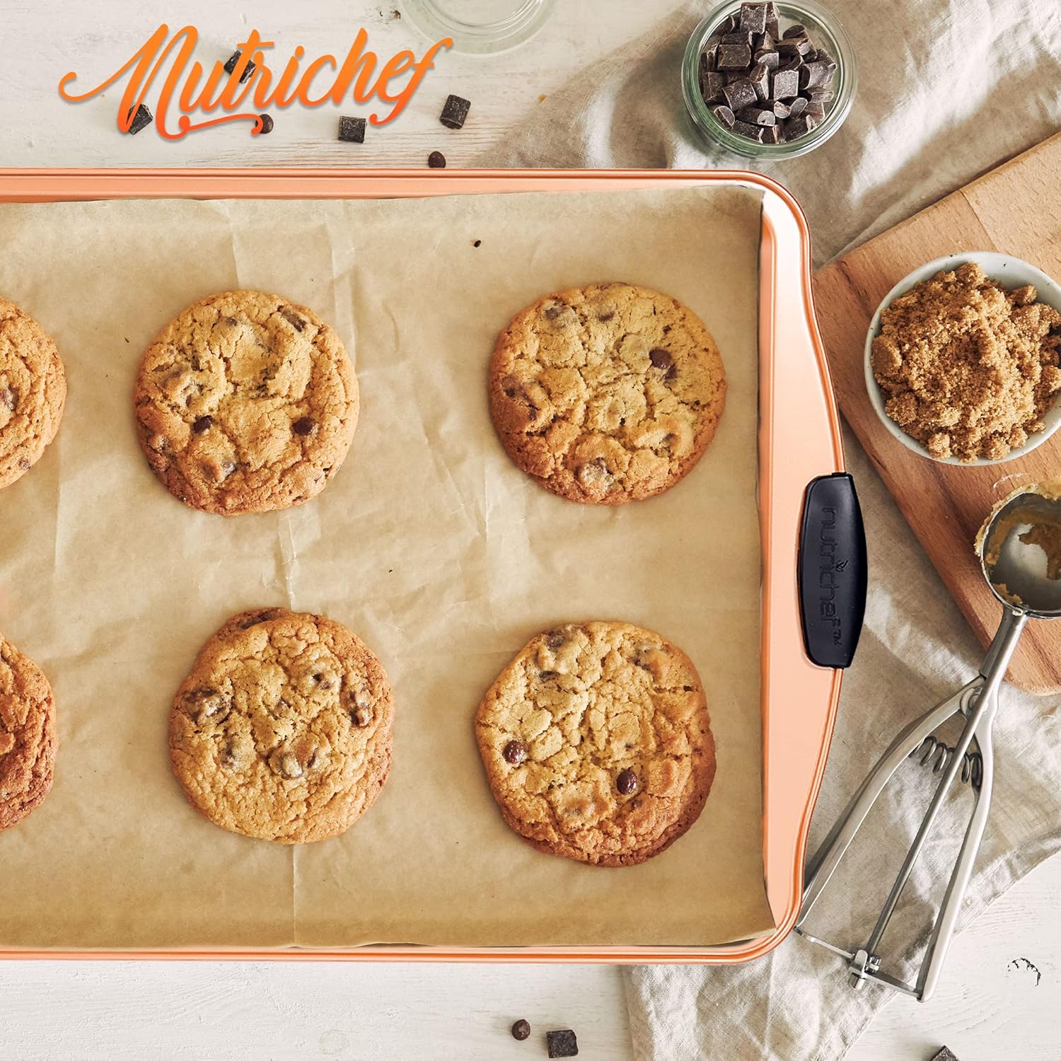Nutrichef Nonstick Cookie Sheet - Premium Carbon Steel Baking Pan with Silicone Handles | 15” Copper, Dishwasher Safe